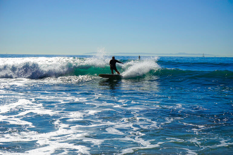 Surfing at Crystal Cove Beach