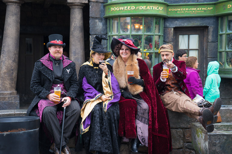 Harry Potter fans in Hogsmeade enjoying Butterbeer